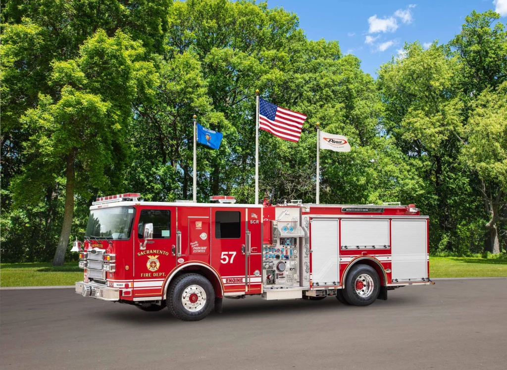 a fire truck in front of flag poles